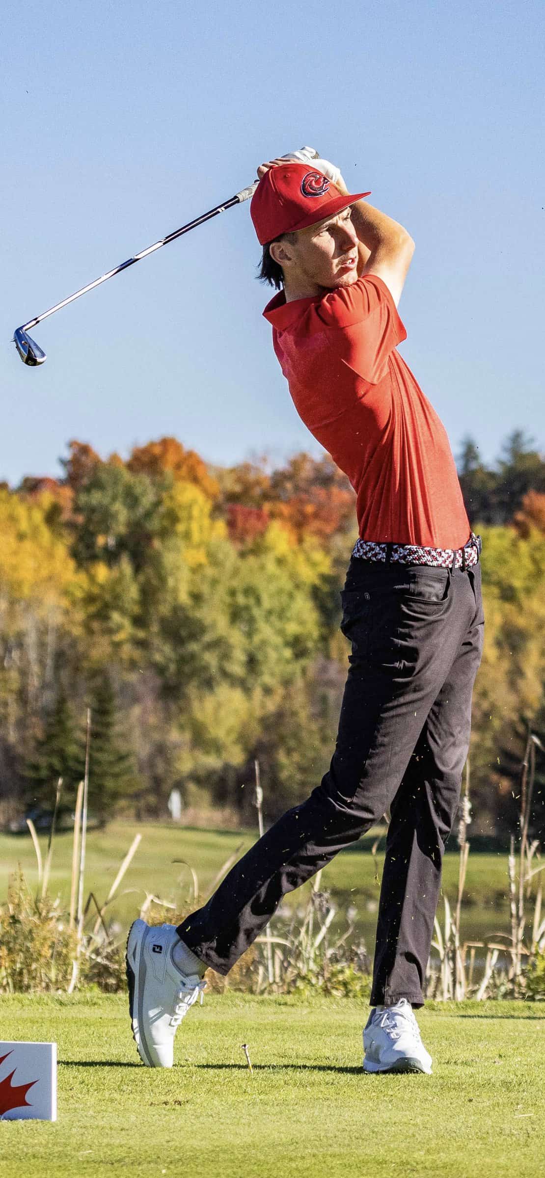 Griffin Rowe following through on a golf swing