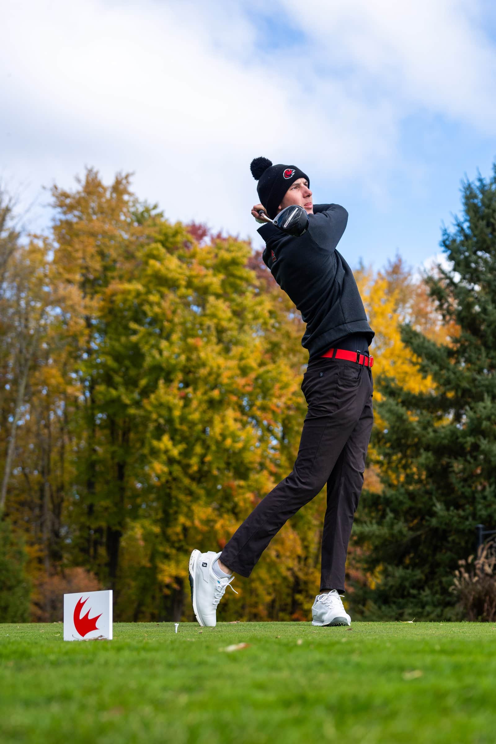 Griffin Rowe at the top of his follow-through after a drive