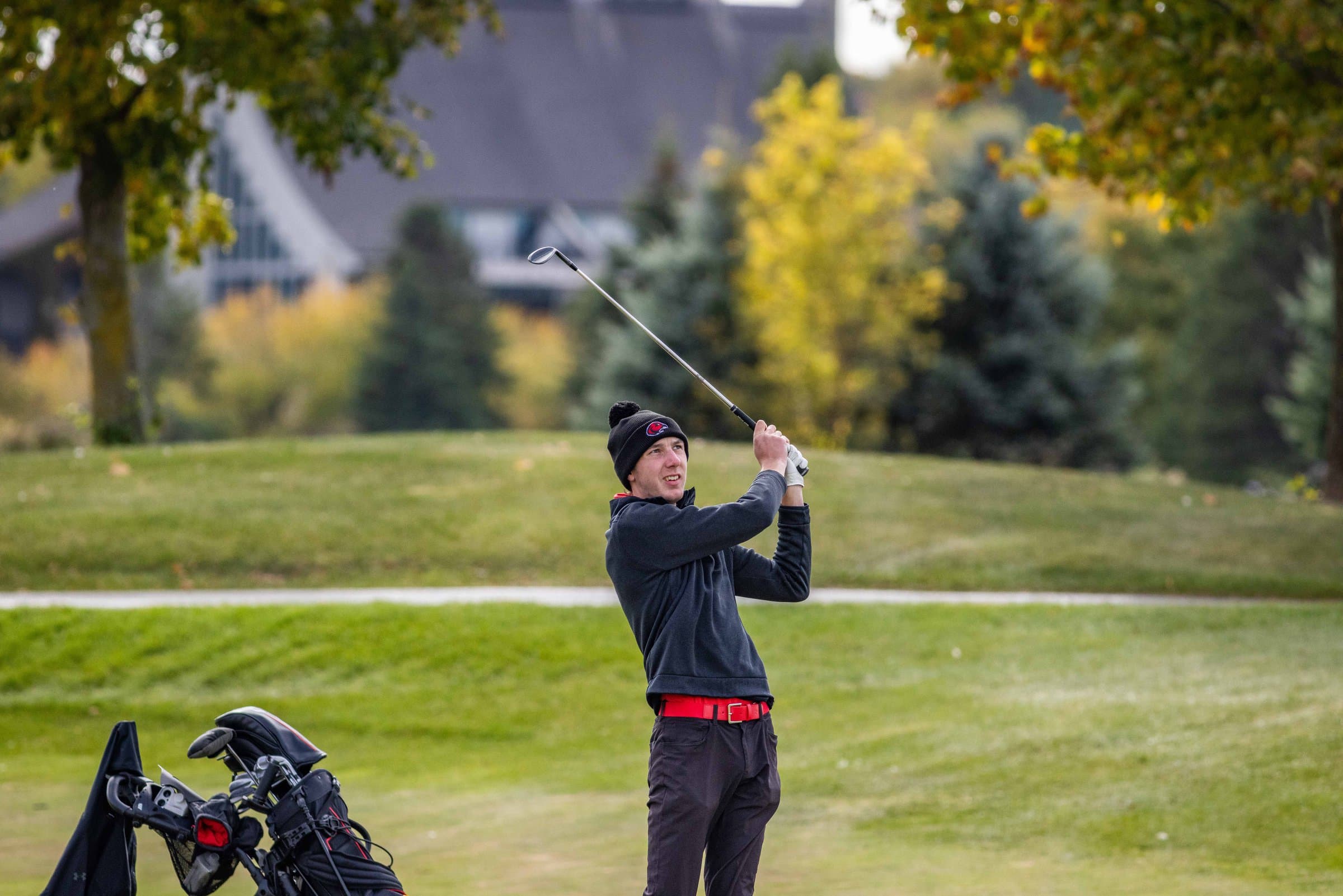 Griffin Rowe watching a shot land after his swing